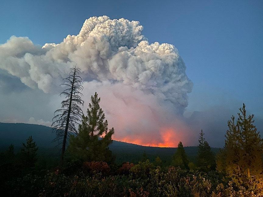 A fire cloud over the ridgeline rising from the Bootleg wildfire in Oregon, July 7, 2021. Image credit: InciWeb/inciweb.nwcg.gov