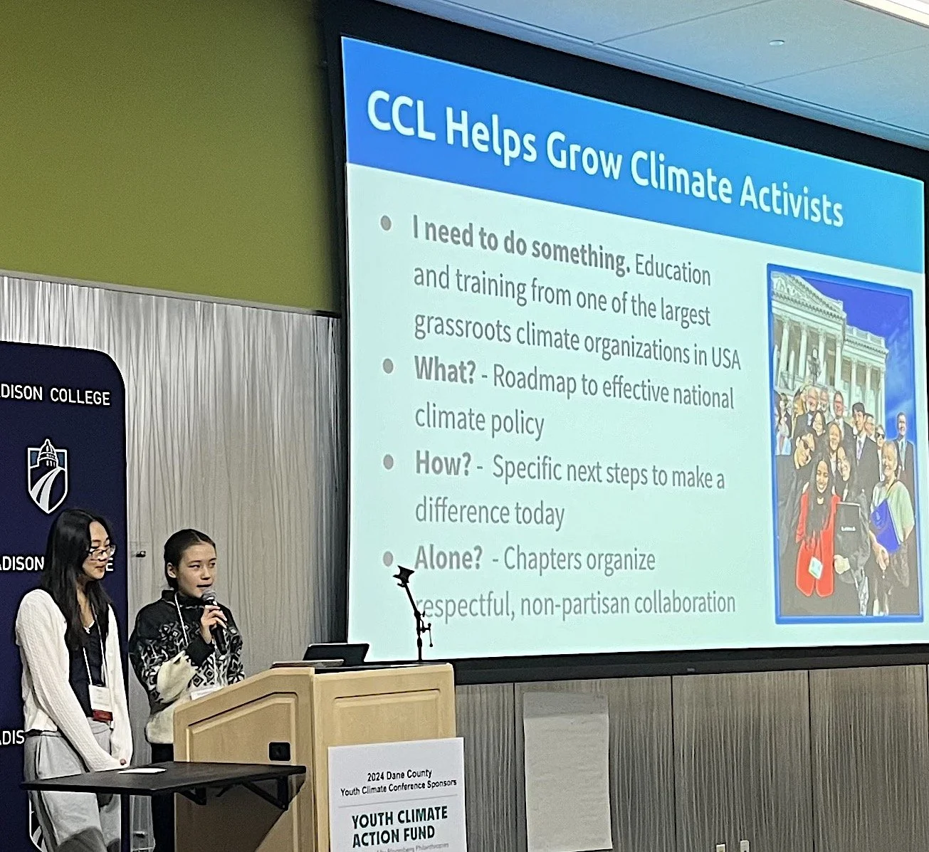  The author, speaking into the microphone, explains Citizens’ Climate Lobby. 