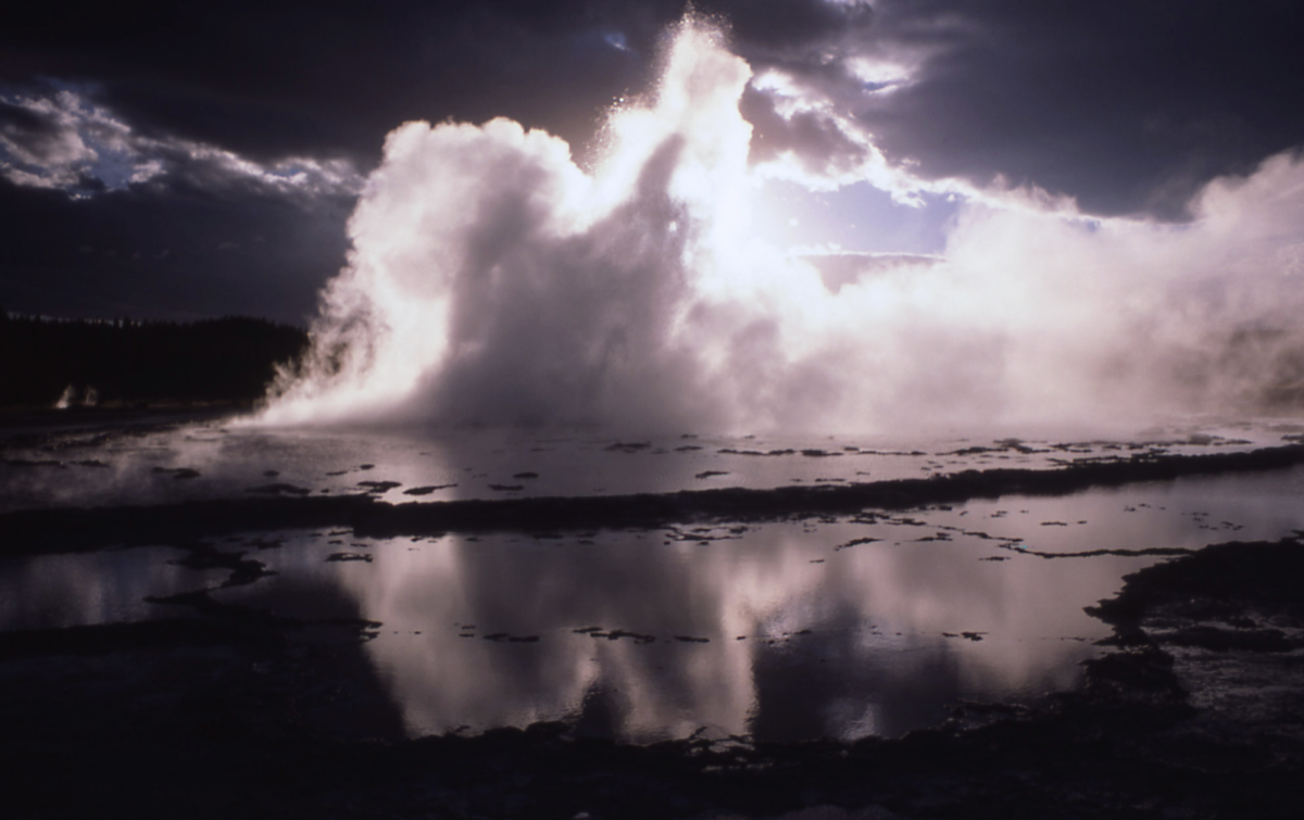 Yellowstone's Great Fountain Geyser with sunset 